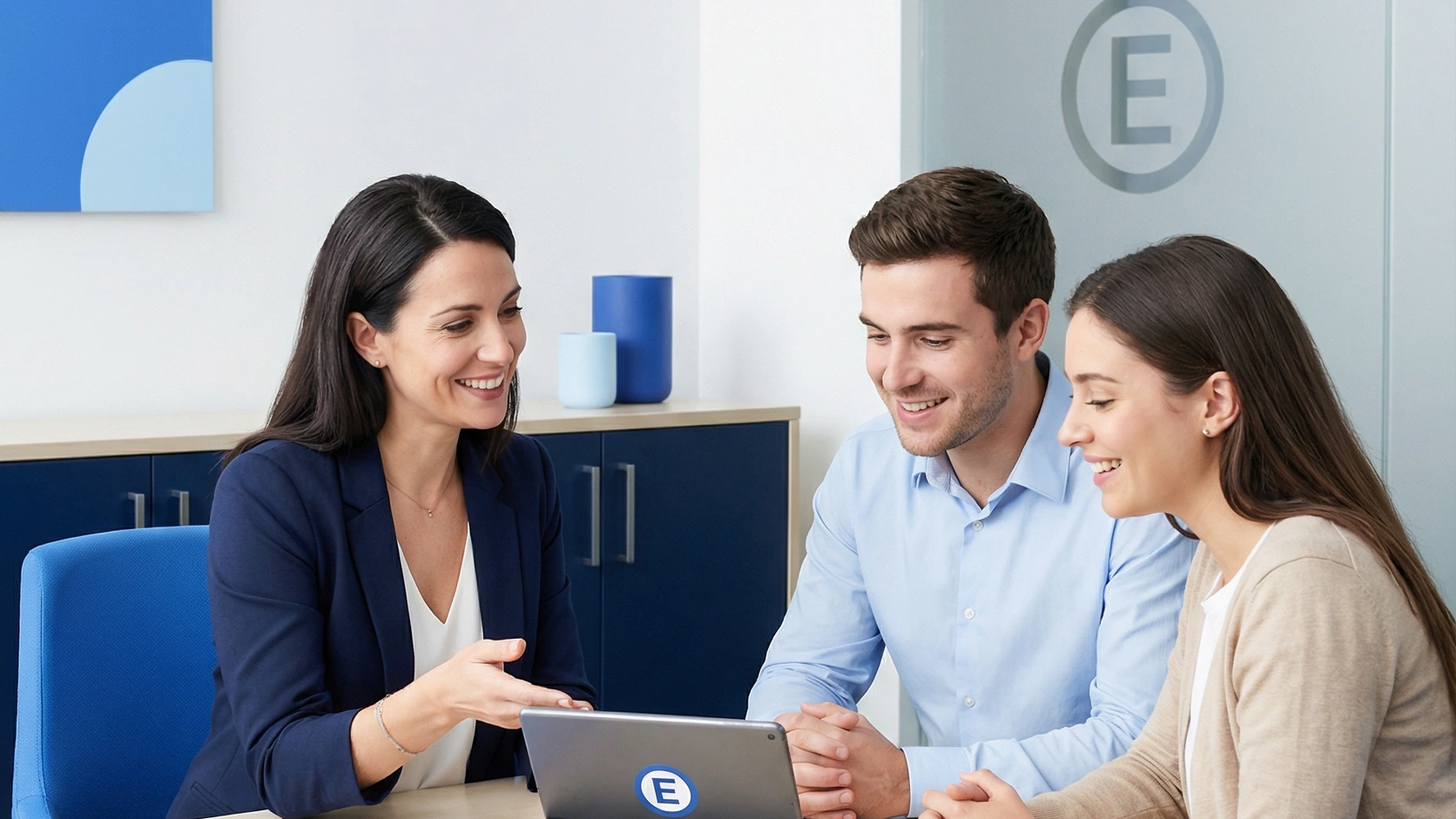 ETANO: a property coordination meeting in the company’s office beneath the official brand emblem.